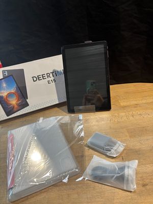 a tablet computer sitting on top of a wooden table