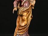an image of a statue of a woman holding a child