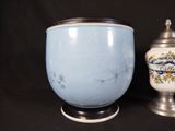 two vases sitting next to each other on a table