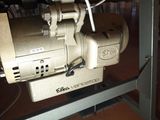an image of a sewing machine under a table