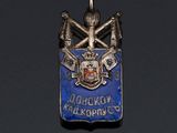 an image of a blue and silver pendant with a coat of arms on it