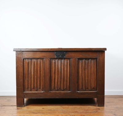 an old wooden chest with a metal latch on the top