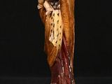 an image of a statue of a woman holding a child