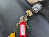 a key that is attached to the seat of a motorcycle