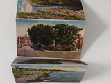 three cards that have pictures of a city on them