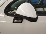 an image of a side view mirror of a white car