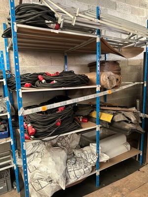 a rack with many different items on it in a room