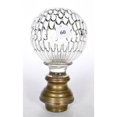 a close up of a glass ball on a metal base