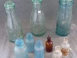 many bottles and bottles that are sitting on a table