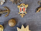 a lot of badges that are on a table