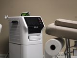 an image of a room with a chair and a machine