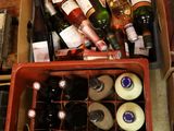 many bottles of wine in a box on the table
