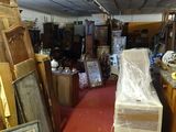 a room with a lot of stuff in it and a red carpet