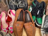 many pairs of shoes that are sitting in a shoe box