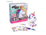 the unicorn is next to a box of stickers and a pen