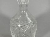 a glass vase that is sitting on a table
