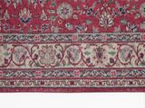 an image of a red rug with a floral design on it