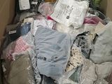 a cardboard box full of clothes and other items