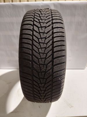 a close up of a tire on a white surface