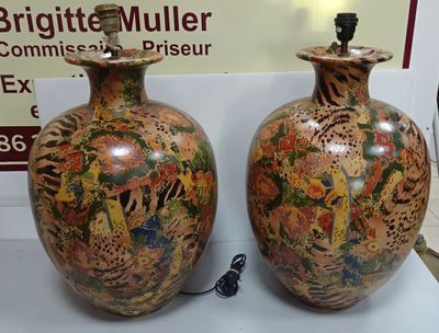 two vases sitting on a table with a sign in the background