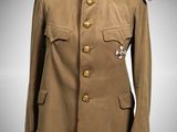 an old military jacket on a mannequin stand with a white background