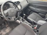 a picture of the interior of a car with a steering wheel