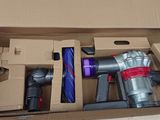 a box with a vacuum and other items inside of it