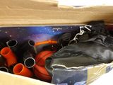 a box with a bunch of sports equipment inside of it
