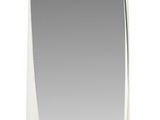 a white oval shaped mirror on a white wall