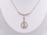 sterling silver necklace with a tear and a diamond pendant on a white mannequin