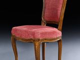 an image of a chair with a red upholstered seat