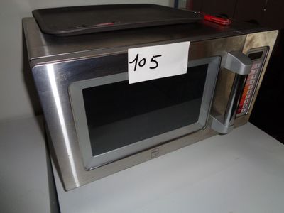 a microwave with a price tag on it sitting on a counter