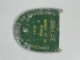 a close up of a green label on a white surface