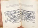 an open book with a drawing of a city on it