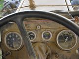 a steering wheel and gauges in a vehicle
