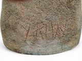 a close up of a vase with writing on it