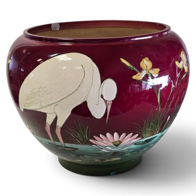 a large vase with a bird painted on it