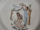 a plate with a picture of a man and a woman on it