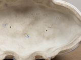 a close up of a white bowl on a table