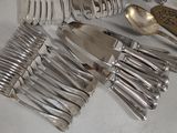a lot of silver spoons and forks on the table