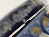 a close up of a blue and white box on a table