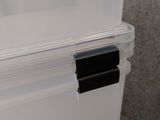 a white box with a black handle on top of it