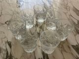 six glasses of water sitting on a marble table