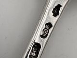 a spoon that has some stickers on it