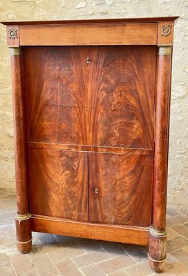 a wooden cabinet with two doors on the top