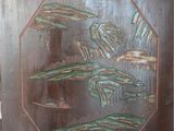 a picture of a wooden cabinet with a painting on it