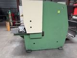 the machine is sitting in the warehouse with the door open