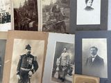 many old photographs of men and women on a table