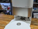 a coffee maker sitting on top of a wooden table