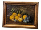 tableau représentant une nature morte composée d'oranges et de bouches d'incendie bleues, dans un cadre en bois